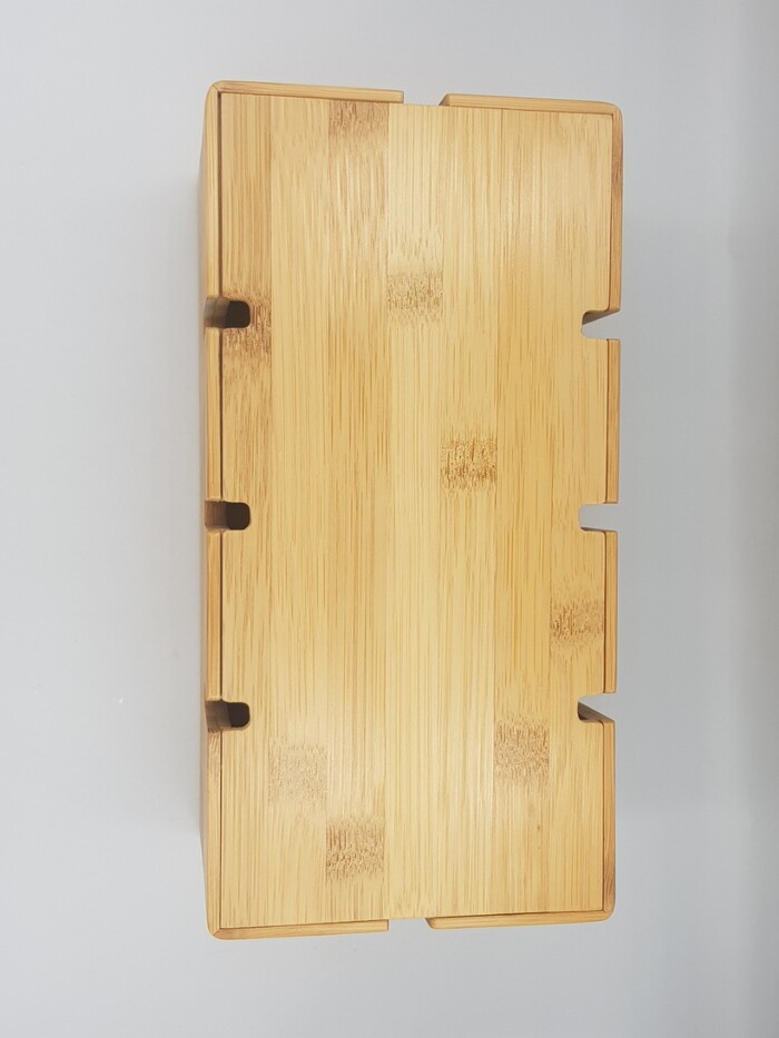 Premium bamboo box for housing electrical outlets.